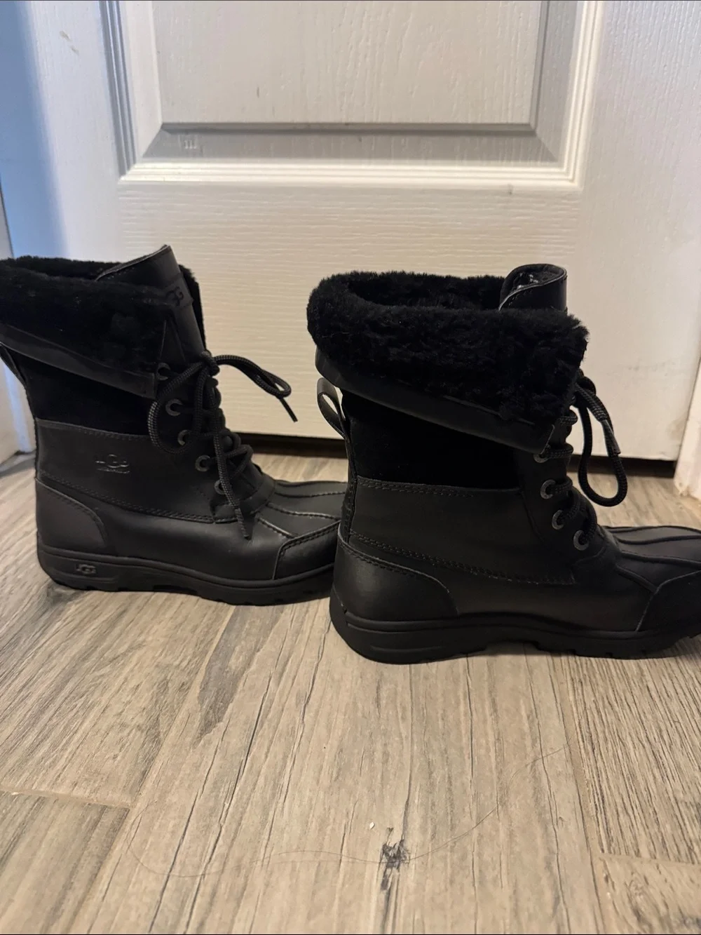 UGG Adirondack water proof insulated lace up winter boots.